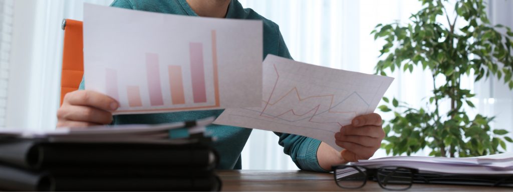 Man working with documents at table in office